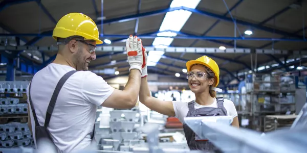 factory-workers-greeting-each-other-successful-teamwork.jpg